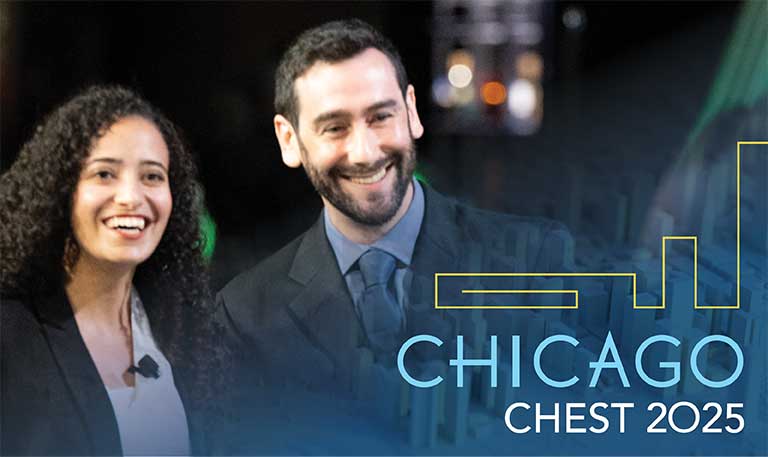 Two people smiling with the CHEST 2025 Chicago logo in the foreground